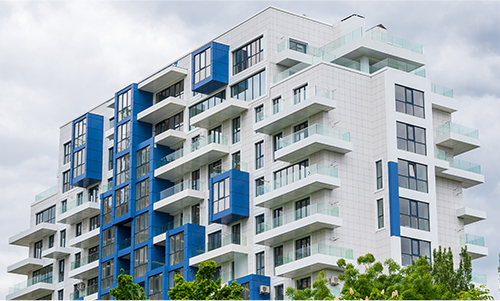 A building with many balconies and windows.